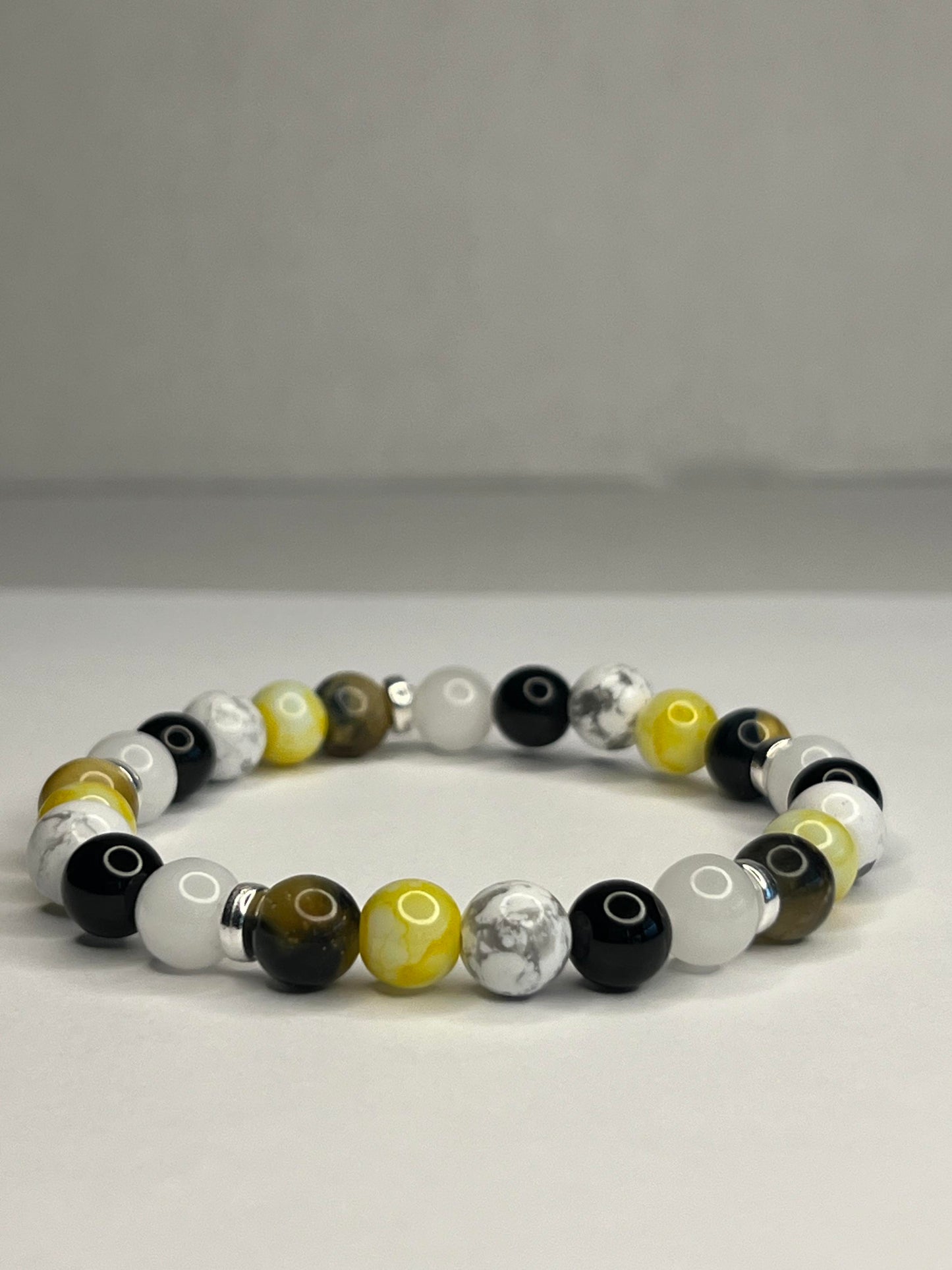 Citrine and Yellow Tiger eye, Pure white quartz, Onyx and Howlite with steel