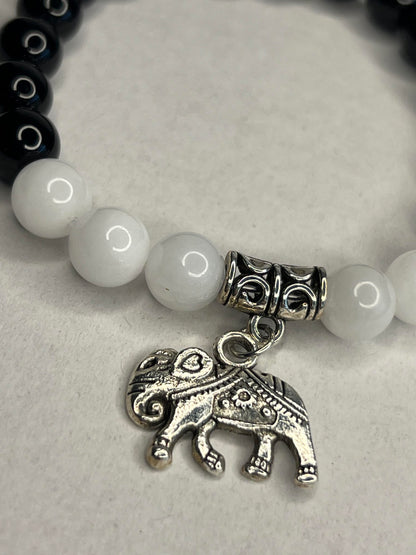 Obsidian with Pure white quartz and steel elephant charm