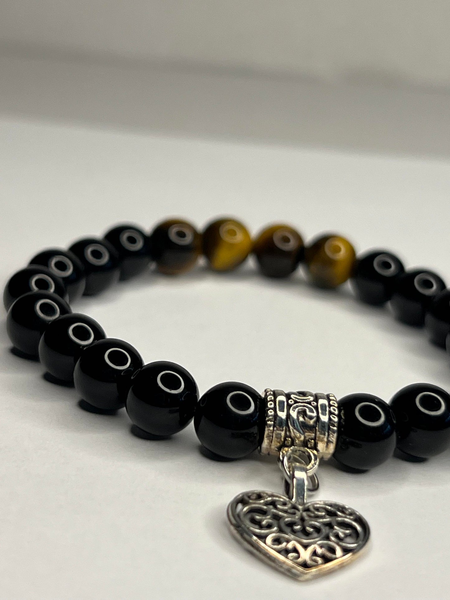 Yellow Tiger eye and Obsidian with steel Heart Charm