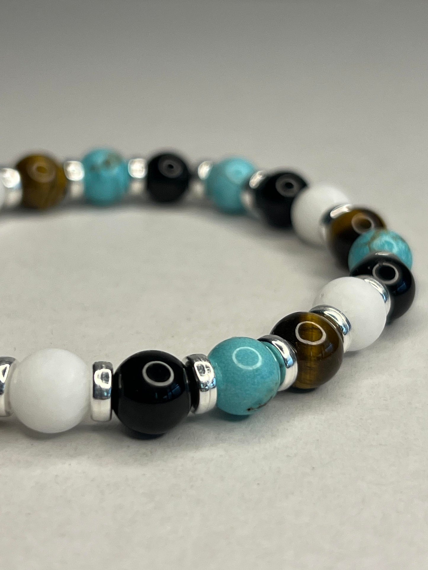 Turquoise and Yellow Tiger Eye with Onyx, Pure White Quartz and steel