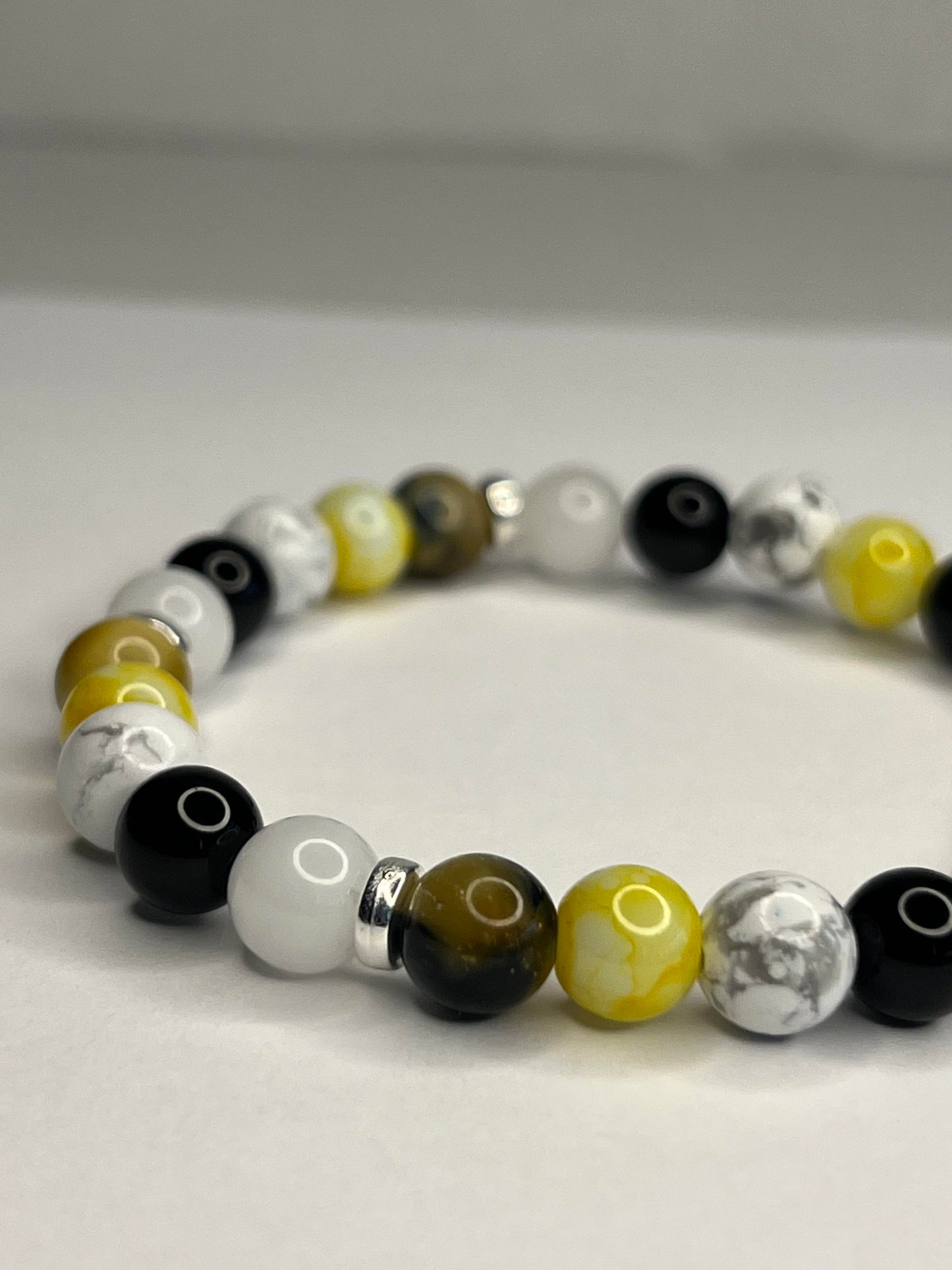 Citrine and Yellow Tiger eye, Pure white quartz, Onyx and Howlite with steel